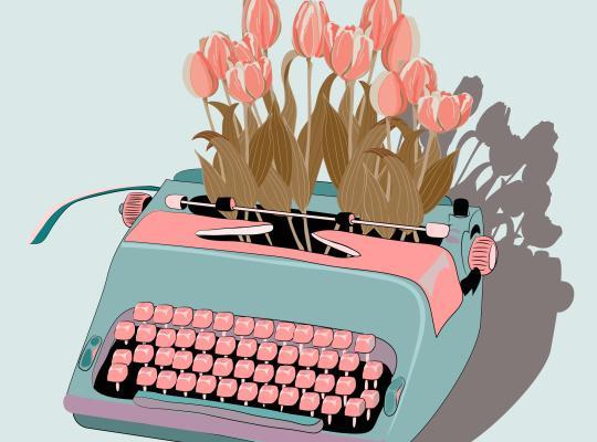 Blue typewriter with bouquet of tulips