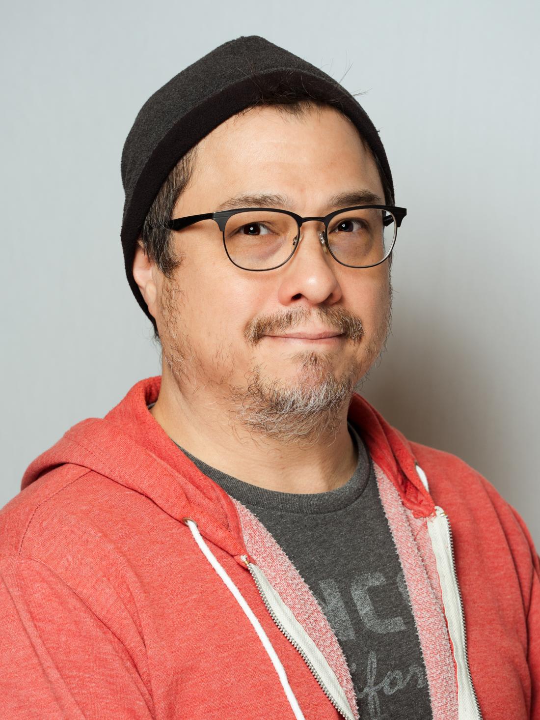 Headshot of Cinema & TV Department Performing Arts Technician Jason Chang against a white backdrop