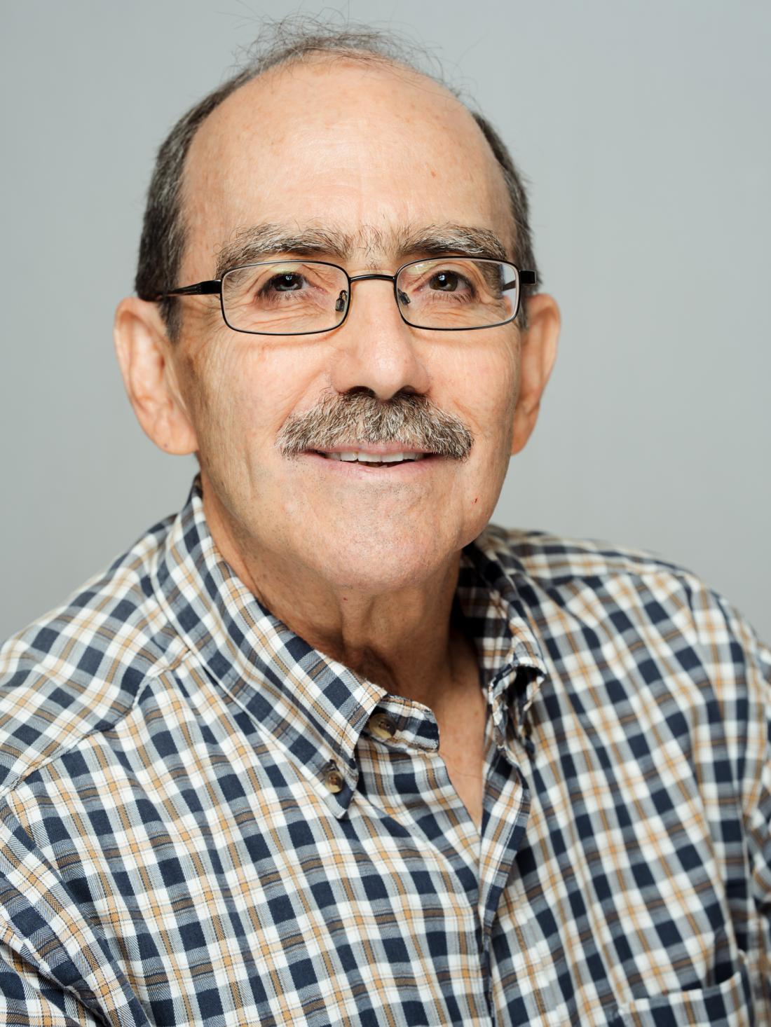 A Headshot of Professor Dr. Jonathan Kuntz against a white backdrop