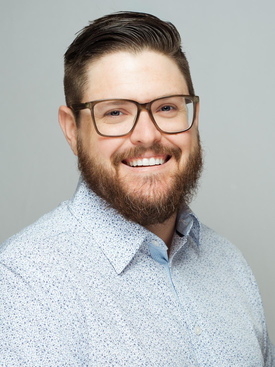 Headshot of Instructional Media Technician Brian Lovelace against white backdrop