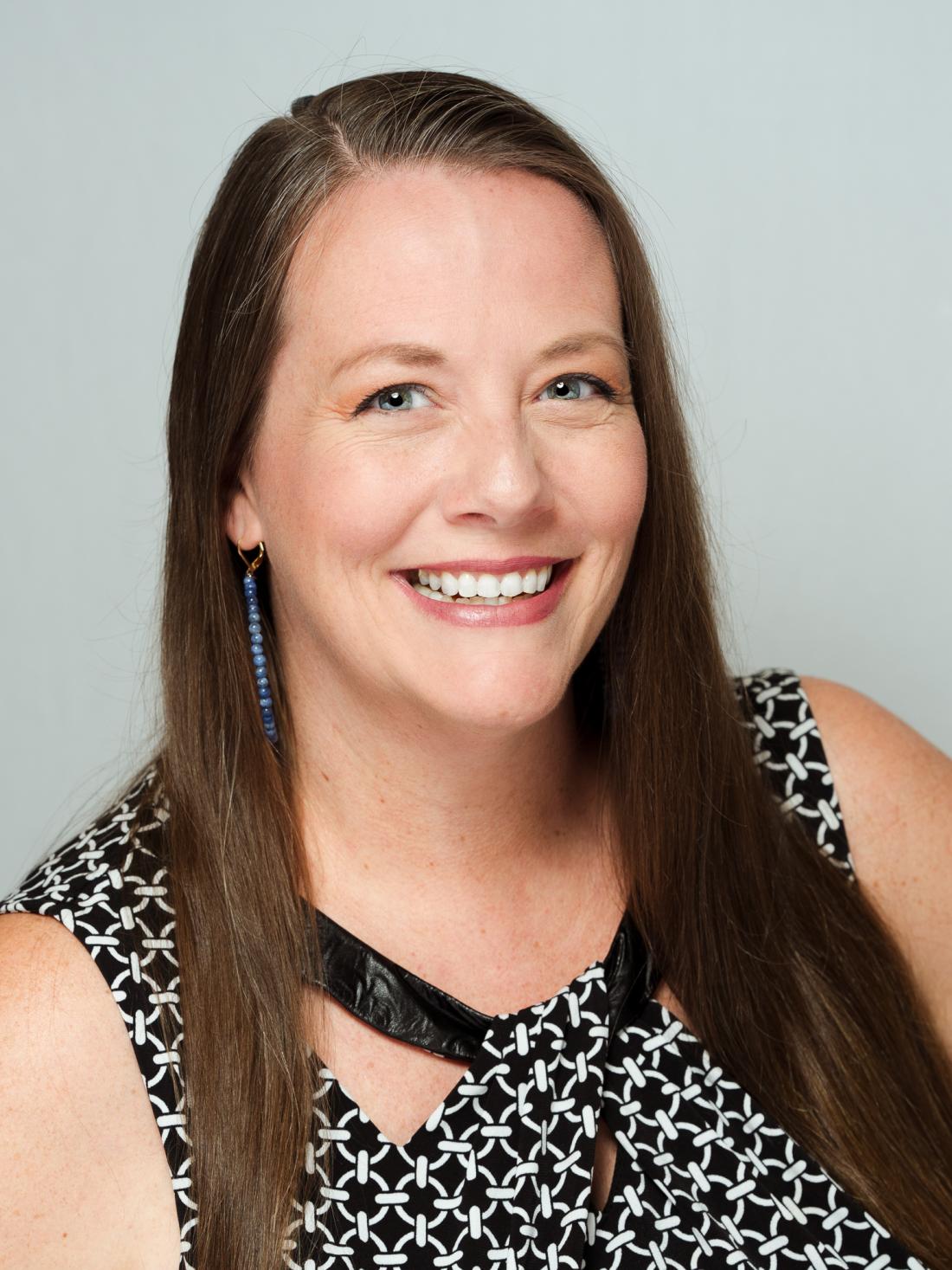 Headshot of Jen Vaughn against a white backdrop