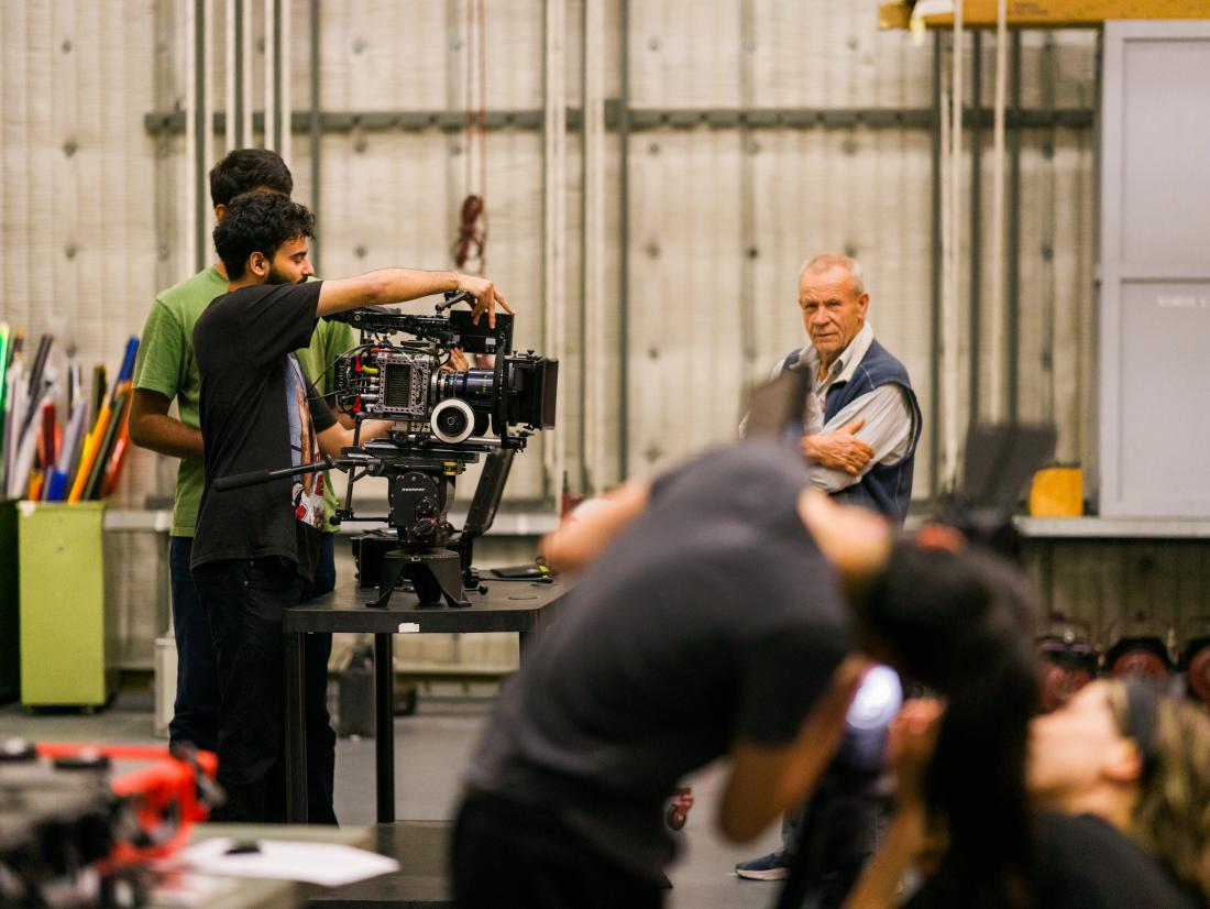Students assemble cameras in LACC's Cinematography Studio, Studio C