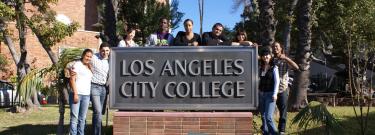 Group of Students on LACC Sign